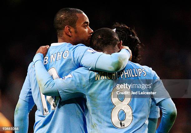 Robinho of Manchester City kisses team mate and goalscorer Shaun Wright-Phillips after his shot deflected in during the Barclays Premier League match...