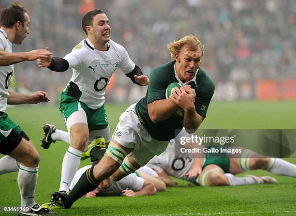 Paddy Wallace of Ireland can't stop Schalk Burger of South Africa from scoring during the the Guinness Series 2009 international match between...