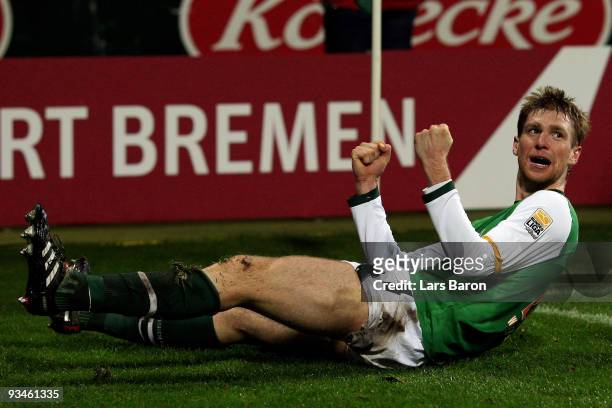 Per Mertesacker of Bremen celebrates after scoring his teams second goal during the Bundesliga match between SV Werder Bremen and VfL Wolfsburg at...
