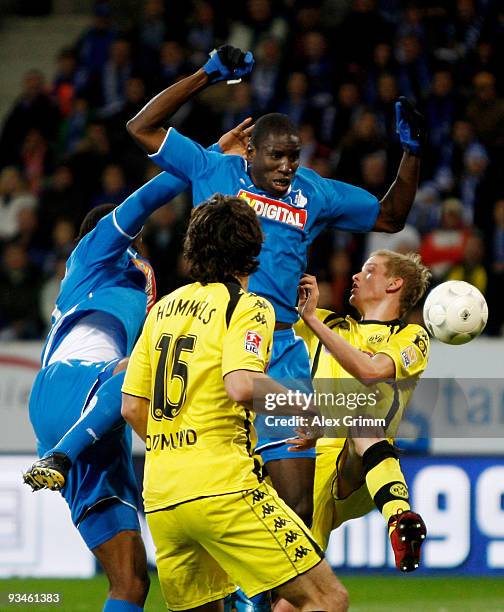 Demba Ba of Hoffenheim is challenged by Sven Bender of Dortmund during the Bundesliga match between 1899 Hoffenheim and Borussia Dortmund at the...