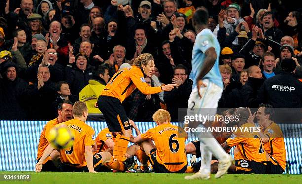 Hull City's English midfielder Jimmy Bullard celebrates after scoring a penalty during the English Premier League football match against Manchester...