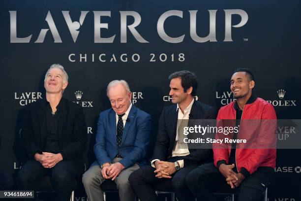 John McEnroe , Rod Laver, Roger Federer of Switzerland, and Nick Kyrgios of Australia laugh during a press conference at the Chicago Athletic...