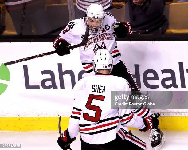 Northeastern Huskies forward Dylan Sikura celebrates his game-tying goal with Northeastern Huskies defenseman Ryan Shea during the second period....