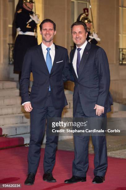 Luxembourg's Prime Minister Xavier Bettel and his husband Gauthier Destenay attend a State dinner at the Elysee Palace on March 19, 2018 in Paris,...