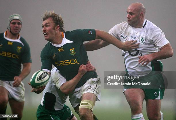 Schalk Burger of South Africa is tackled by John Hayes of Ireland during the Guinness Series 2009 match between Ireland and South Africa at Croke...