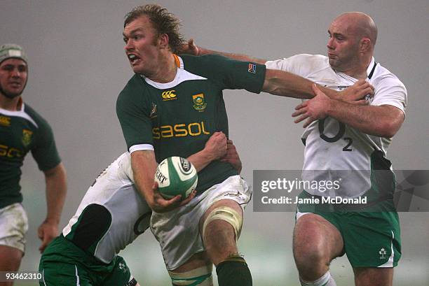 Schalk Burger of South Africa is tackled by John Hayes of Ireland during the Guinness Series 2009 match between Ireland and South Africa at Croke...