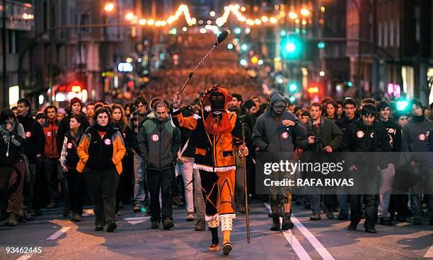 Basque traditional dancer heads a demonstration, followed by thousands of people marching in the northern Spanish Basque city of Bilbao in protest of...