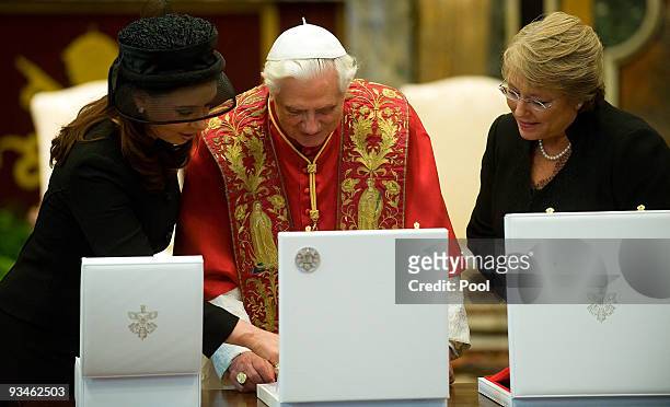 Chile's President Michelle Bachelet and Argentina's President Cristina Fernandez de Kirchner exchanges gifts to Pope Benedict XVI at the Clementine...