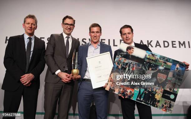 Hannes Wolf poses with Frank Wormuth, Friedrich Curtius and Lars Ricken after being awarded 'Coach of the Year' during the Coaching Award Ceremony &...