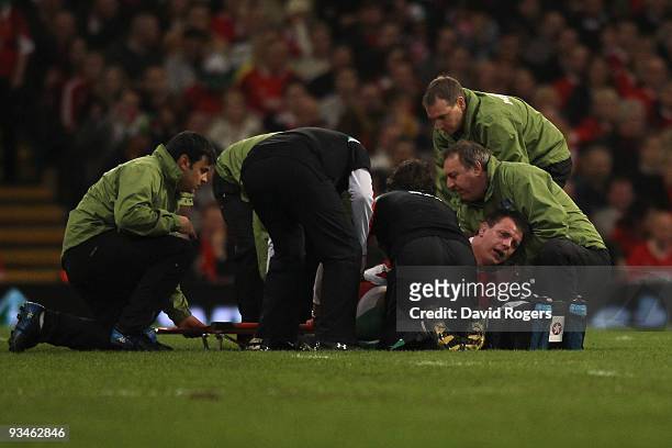 The injured Matthew Rees of Wales is stretchered off the pitch during the Invesco Perpetual Series match between Wales and Australia at the...