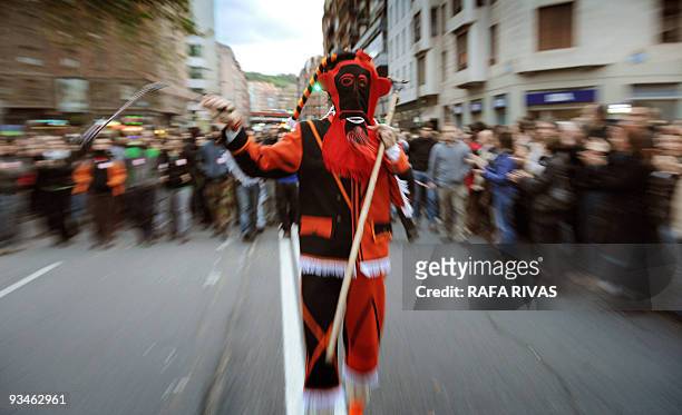 Basque traditional dancer heads a demonstration, followed by thousands of people marching in the northern Spanish Basque city of Bilbao in protest of...