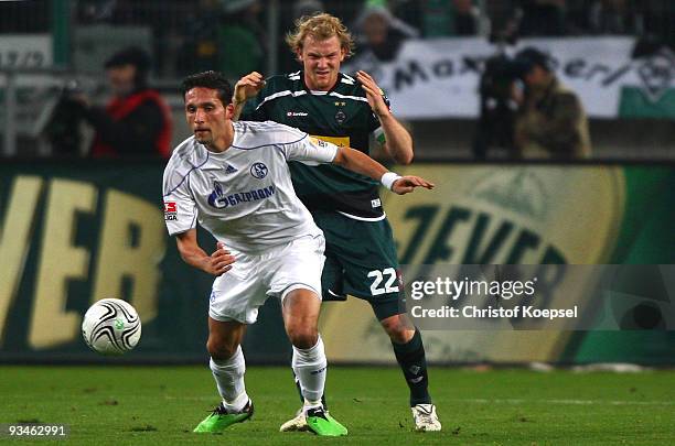 Tobias Levels of Moenchengladbach challenges Kevin Kuranyi of Schalke during the Bundesliga match between Borussia Moenchengladbach and FC Schalke 04...