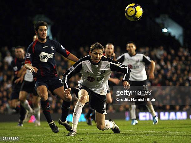 Zoltan Gera of Fulham heads the ball during the Barclays Premier League match between Fulham and Bolton Wanderers at Craven Cottage on November 28,...