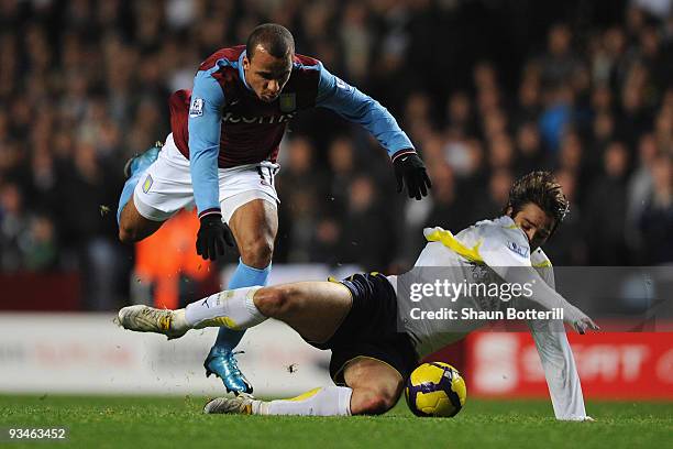 Niko Kranjcar of Tottenham Hotspur tangles with Gabriel Agbonlahor of Aston Villa during the Barclays Premier League match between Aston Villa and...