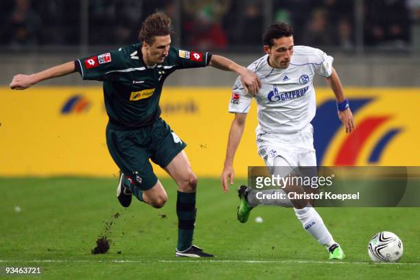 Roel Brouwers of Moenchengladbach challenges Kevin Kuranyi of Schalke during the Bundesliga match between Borussia Moenchengladbach and FC Schalke 04...