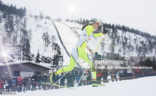 Katja Visnar of Slovenia competes in the Women's Sprint qualification Cross Country Skiing during day one of the FIS World Cup on November 28, 2009...