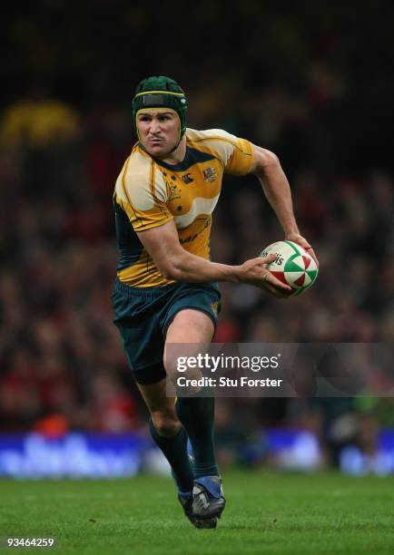 Australia fly half Matt Giteau makes a break during the Invesco Perpetual match between Wales and Australia at Millennium Stadium on November 28,...