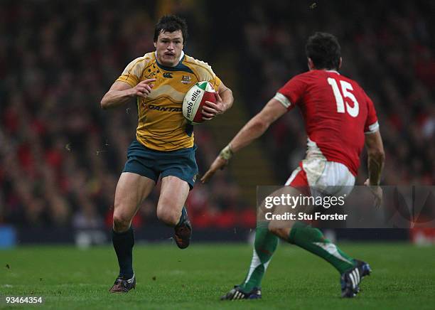 Australia full back Adam Ashley-Cooper runs at James Hook of Wales during the Invesco Perpetual match between Wales and Australia at Millennium...