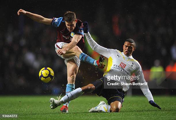 James Milner of Aston Villa is tackled by Jermaine Jenas of Tottenham Hotspur during the Barclays Premier League match between Aston Villa and...