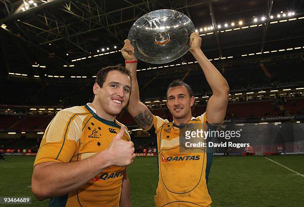 Ben Alexander and Quade Cooper of Australia celebrate with the trophy following their team's victory during the Invesco Perpetual Series match...