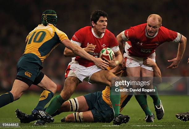 James Hook of Wales is challenged by Matt Giteau of Australia during the Invesco Perpetual Series match between Wales and Australia at the Millennium...