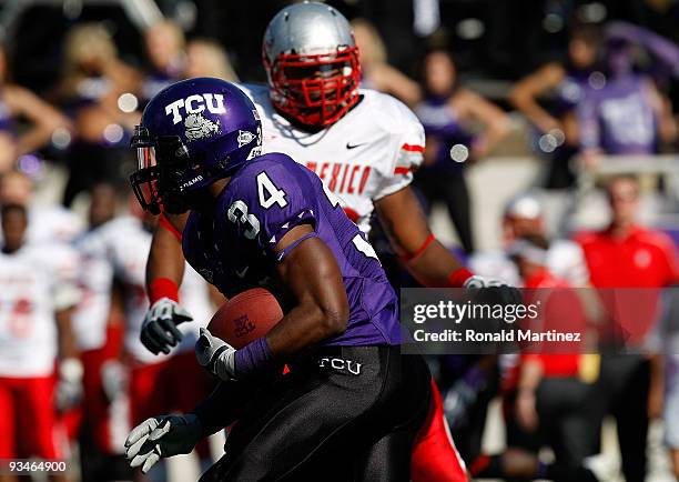 Running back Ed Wesley of the TCU Horned Frogs runs the ball against the New Mexico Lobos at Amon G. Carter Stadium on November 28, 2009 in Fort...