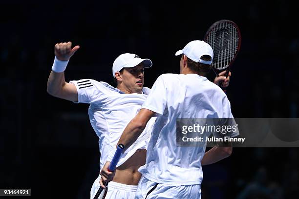 Bob Bryan of USA celebrates with Mike Bryan of USA after they won the men's semi final match against Mahesh Bhupathi of India and Mark Knowles of The...