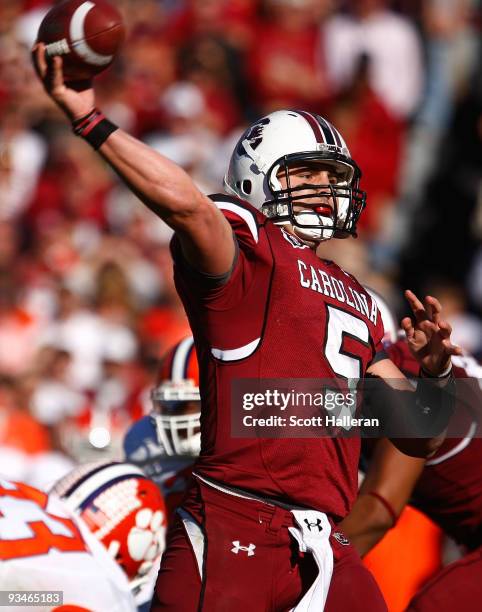 Stephen Garcia of the South Carolina Gamecocks drops back to pass against the Clemson Tigers at Williams-Brice Stadium on November 28, 2009 in...