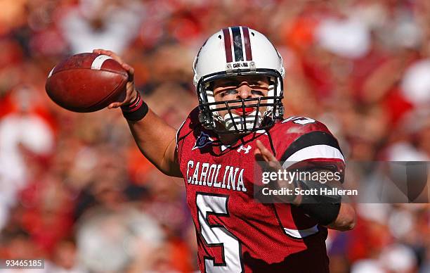 Stephen Garcia of the South Carolina Gamecocks drops back to pass against the Clemson Tigers at Williams-Brice Stadium on November 28, 2009 in...