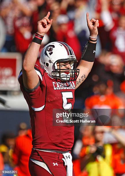 Stephen Garcia of the South Carolina Gamecocks celebrates a second half touchdown against the Clemson Tigers at Williams-Brice Stadium on November...