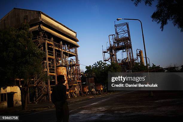 Policeman tours the site of the deserted Union Carbide factory on November 28, 2009 in Bhopal, India. Twenty-five years after an explosion causing a...