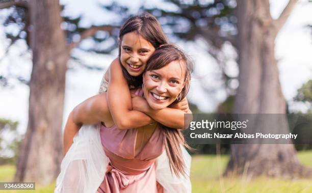 mother and daughter making heart shape with hands. - nazar abbas stock pictures, royalty-free photos & images