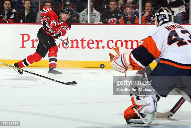 Patrik Elias of the New Jersey Devils takes a shot against Martin Biron of the New York Islanders at the Prudential Center on November 28, 2009 in...