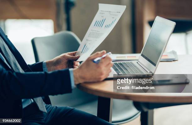 hands of businessman notebook and documents working - rates stock pictures, royalty-free photos & images
