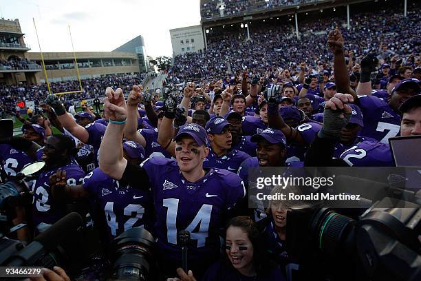 Quarterback Andy Dalton of the TCU Horned Frogs celebrates a win against the New Mexico Lobos at Amon G. Carter Stadium on November 28, 2009 in Fort...