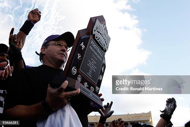 Head coach Gary Patterson of the TCU Horned Frogs raises the Mountain West Regular Season Championship trophy at Amon G. Carter Stadium on November...