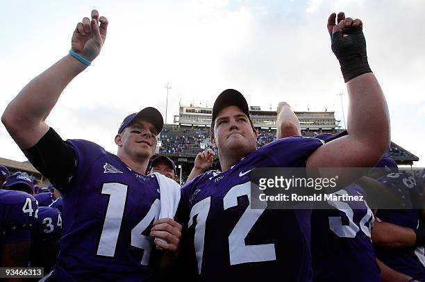 Quarterback Andy Dalton and Kyle Dooley of the TCU Horned Frogs celebrate after defeating the New Mexico Lobos at Amon G. Carter Stadium on November...
