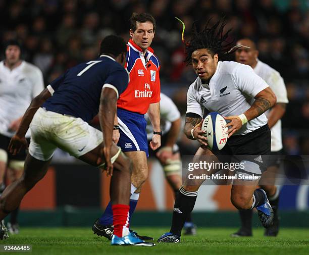 Ma'a Nonu of New Zealand runs at Fulgence Ouedraogo of France during the France v New Zealand International match at the Stade Velodrome on November...