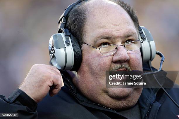 Head coach Mark Mangino of the Kansas Jayhawks watches from the sidelines during the game against the Missouri Tigers at Arrowhead Stadium on...