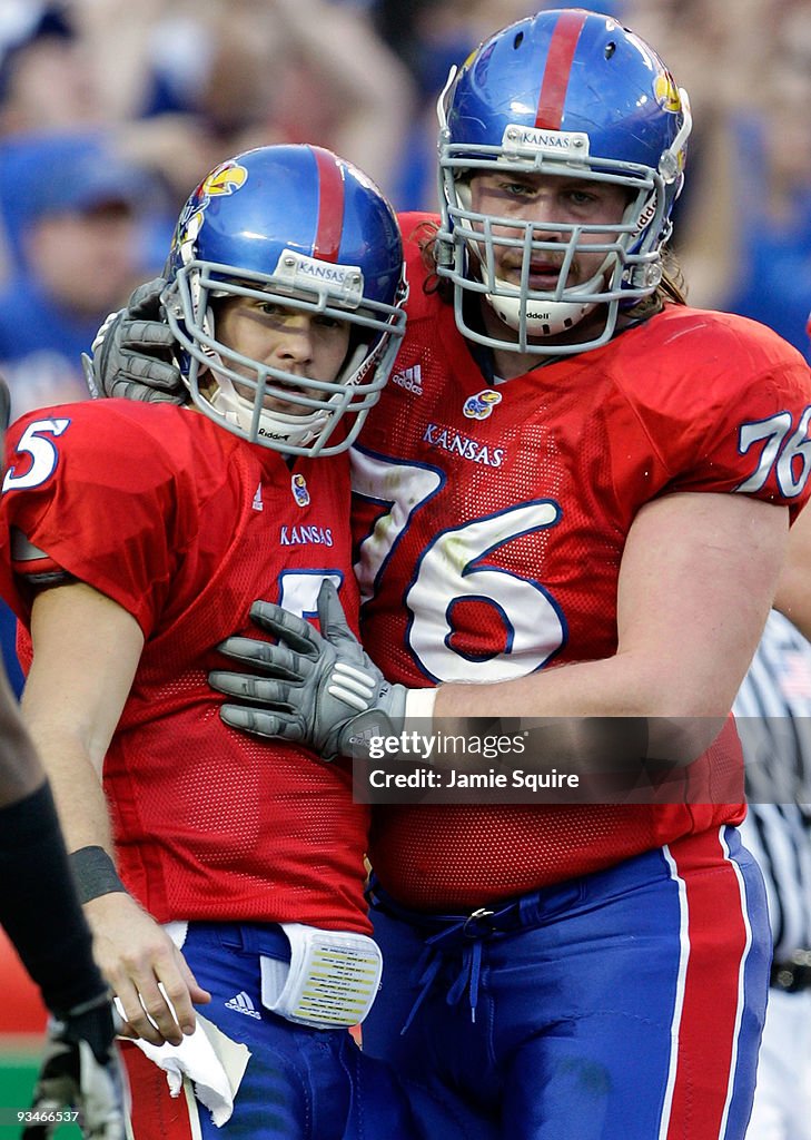 Dirk Reesing Quarterback Todd Reesing of the Kansas Jayhawks is congratulated by ...