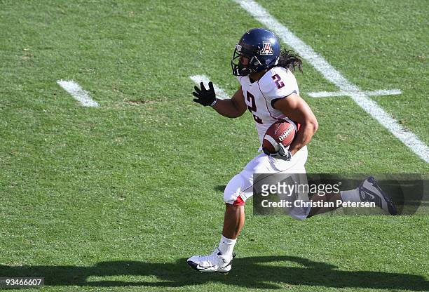 Wide reciver Keola Antolin of the Arizona Wildcats rushes for a 68 yard touchdown against the Arizona State Sun Devils during the college football...