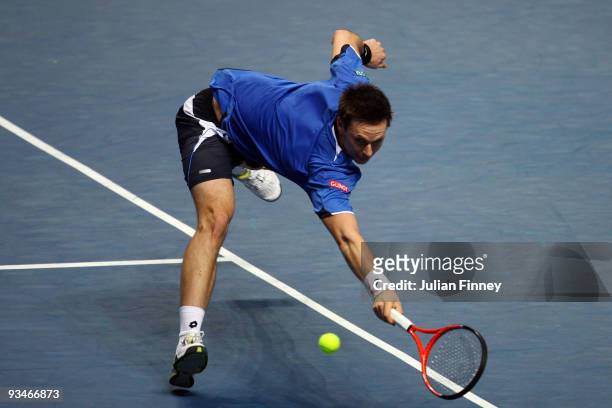 Robin Soderling of Sweden reaches for the ball during the men's singles semi final match against Juan Martin Del Potro of Argentina during the...