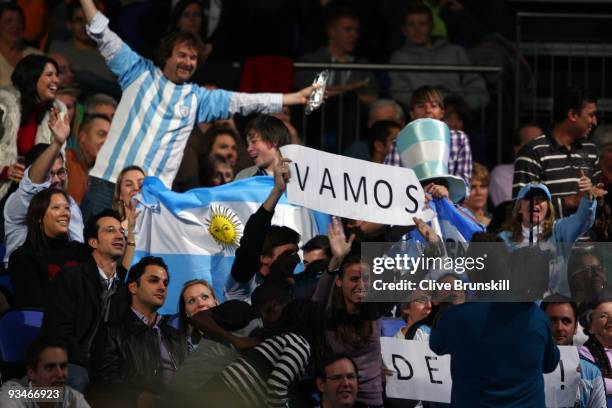 Supporters watch Juan Martin Del Potro of Argentina play against Robin Soderling of Sweden in the men's singles semi final match against during the...