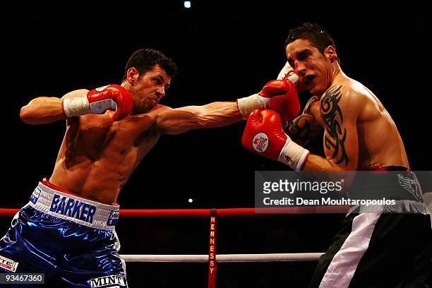 Darren Barker of Barnet lands a punch on Danny Butler of Bristol in their British and Commonwealth Middleweight bout at the Brentwood Centre on...