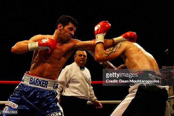 Darren Barker of Barnet lands a punch on Danny Butler of Bristol in their British and Commonwealth Middleweight bout at the Brentwood Centre on...