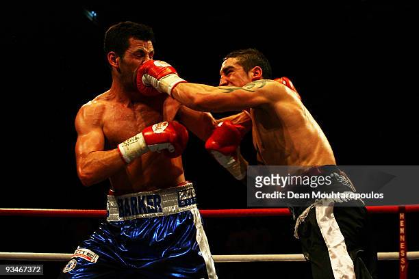 Darren Barker of Barnet is hit by Danny Butler of Bristol in their British and Commonwealth Middleweight bout at the Brentwood Centre on November 28,...