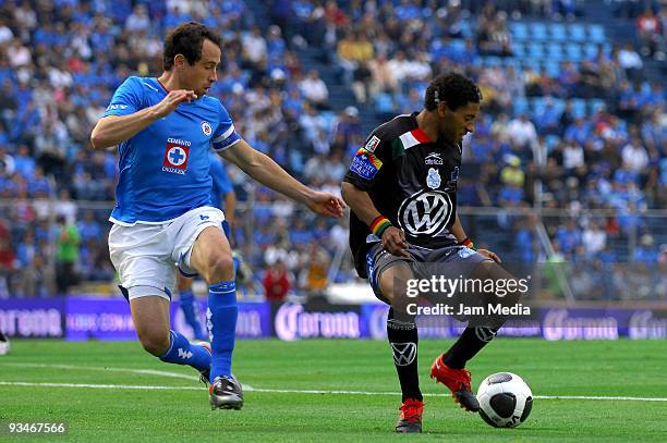 Gerardo Torrado of Cruz Azul vies for the ball with Nicolas Olivera of Puebla during their quarterfinals match as part of the 2009 Opening tournament...