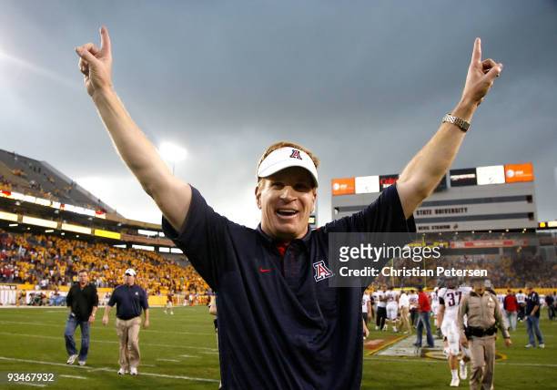 Head coach Mike Stoops of the Arizona Wildcats celebrates after defeating the Arizona State Sun Devils in the college football game at Sun Devil...