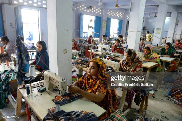 The capital city of Dhaka. Small textile factory in the city of Dhaka where employees work 24 hours a day. Dhaka is the capital of Bangladesh June...