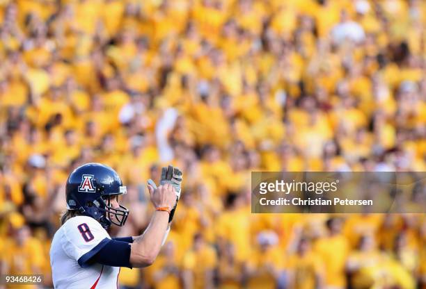 Quarterback Nick Foles of the Arizona Wildcats calls a time out during the college football game against the Arizona State Sun Devils at Sun Devil...